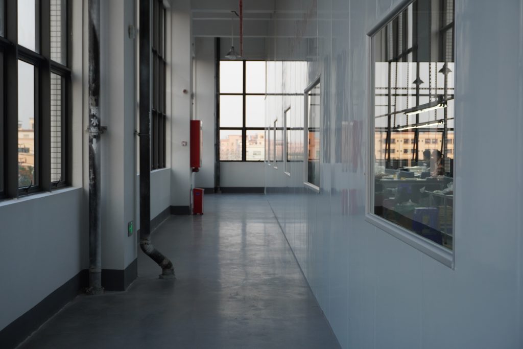 A corridor inside Padmat Rubber’s new factory in Dongguan, China, connecting production areas used by the rubber mat OEM supplier.