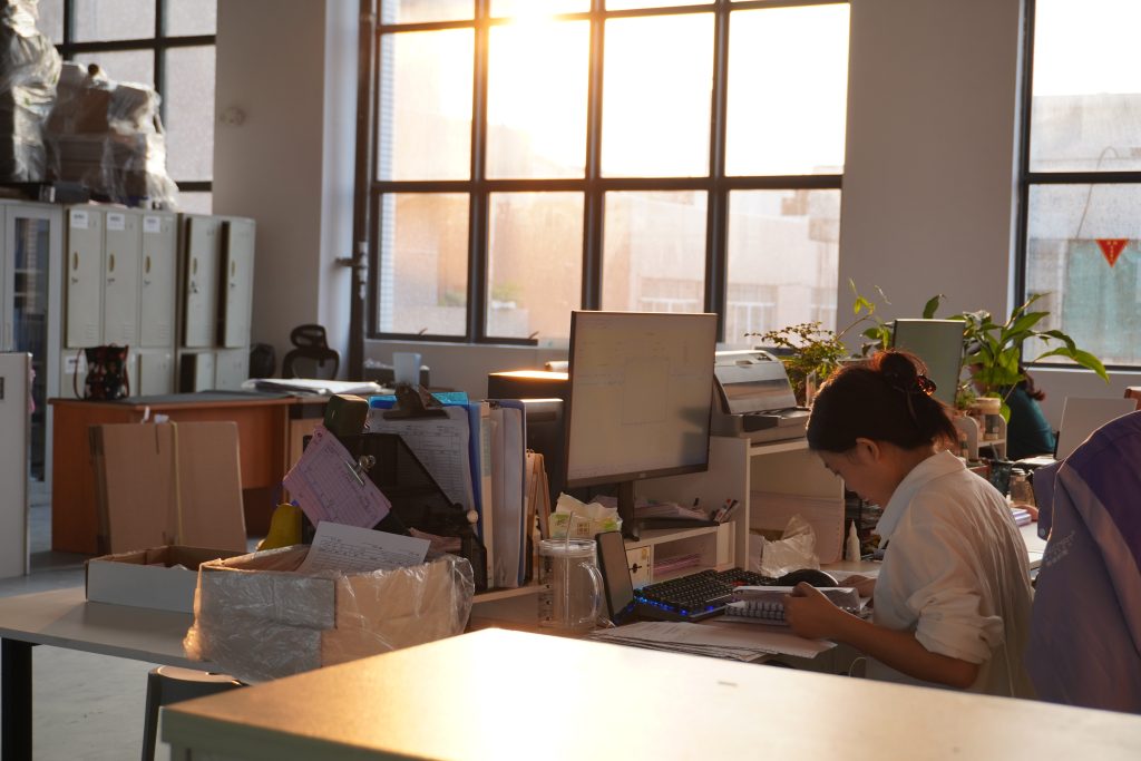 An employee working at a desk inside Padmat Rubber’s new office area