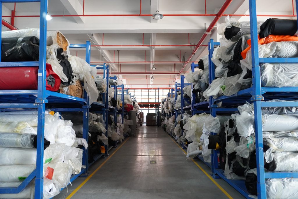 Organized raw material warehouse of professional mouse pad manufacturer, ensuring stable supply.