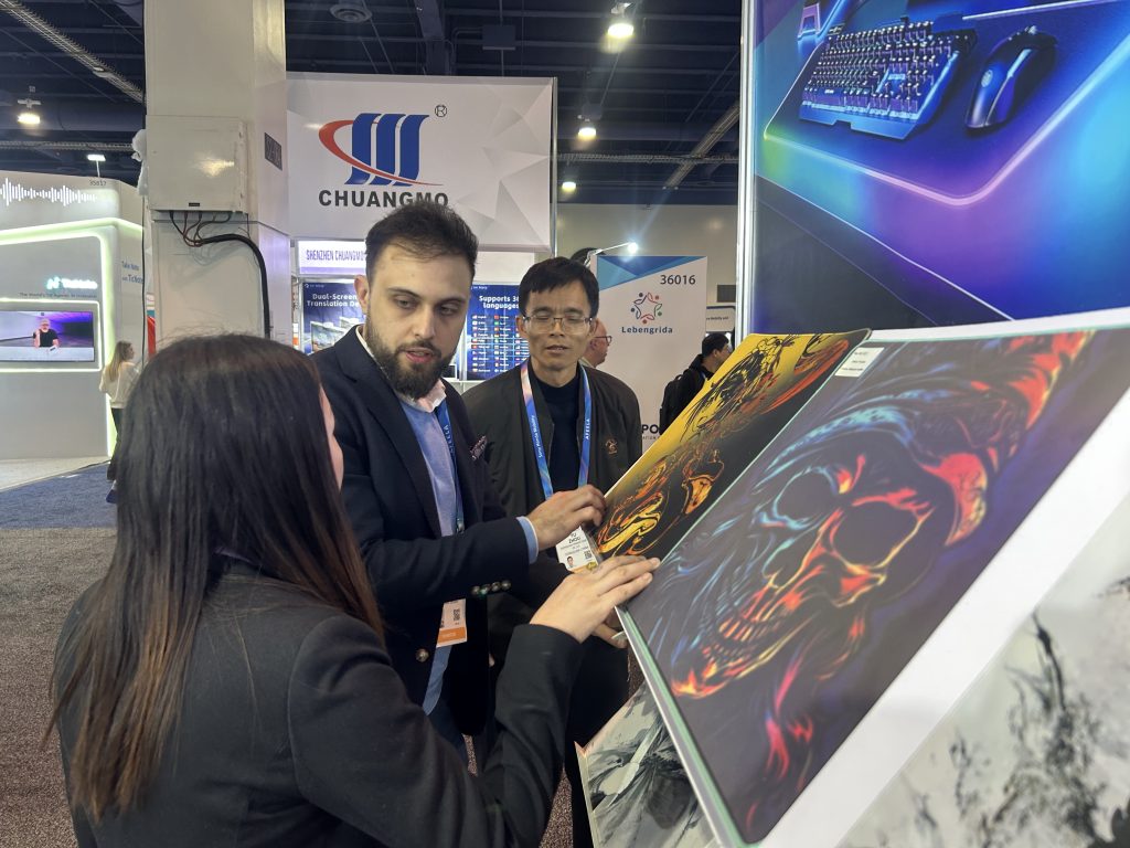 Padmat Rubber team discussing custom mouse pad designs with international clients at CES 2026 Las Vegas