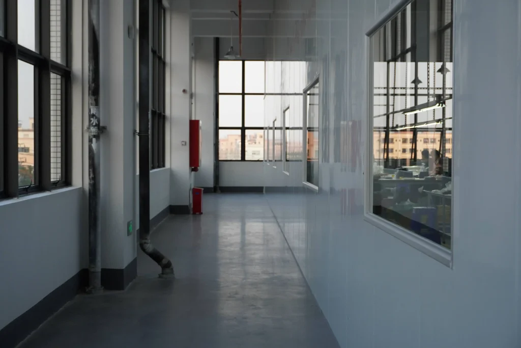 A corridor inside Padmat Rubber’s new factory in Dongguan, China, connecting production areas used by the rubber mat OEM supplier.